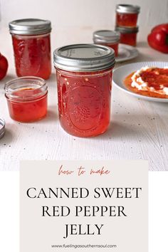 canned sweet red pepper jelly in mason jars on a table with apples and other food