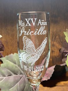 a wine glass with a butterfly on it