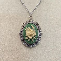 Green and ivory rose resin cameo set in silver tone tray made from alloy coated brass.  Cameo (without tray) measures 13x18mm. Chain is 18 inches and stainless steel. Cameo Necklace, Favorite Jewelry, Necklace Etsy, Beauty Book, Silver Tone, Jewelry Necklaces, Accessory Gift, Necklaces, Electronic Accessories