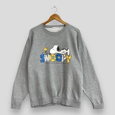 "REMINDER: THIS IS USED CLOTHING PLEASE DO NOT EXPECTED IT LIKE TO BE NEW OR IN PRISTINE CONDITION Feel free to contact me for any question. I'll assist you with my pleasure. Vintage 90's SNOOPY Cartoon Crewneck Sweatshirt Medium Snoopy Joe Cole And Woodstock Spellout Sweater Comic Strip Snoopy Gray Jumper Size M *All measurements are taken with the garment flat on the ground. SIZE ON TAG :- None but fits like Size M ACTUAL SIZE MEASUREMENT :- ARM PIT TO ARM PIT :- 21.5\" inches BACK COLLAR TO HEM :- 26\" inches CONDITION :- GREAT USED CONDITION. HAVE YELLOW STAINS (KINDLY REFER TO THE PICTURES ATTACHED) ** WE ARE USING DHL EXPRESS, IT TAKES 3-5 WORKING DAYS ONLY TO ARRIVE. PLEASE LEAVE YOUR PHONE NUMBER ON THE NOTE WHILE MAKE A PURCHASE** REF : (22-05-2021) 1028" Snoopy Crewneck, Snoopy Sweater, Joe Cole, Cold Weather Jackets, Red Pullover Sweater, Snoopy Cartoon, Artist Shirts, Distressed Sweatshirt, Grey Jumper