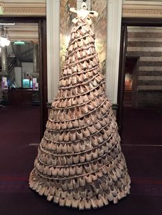 there is a large pile of shoes on display