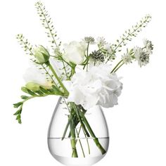 a clear vase with white flowers in it