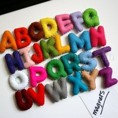 an alphabet made out of felt letters and numbers