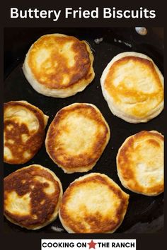 several pancakes cooking in a skillet with buttery fried biscuits