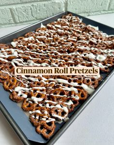 cinnamon roll pretzels with icing on a baking sheet