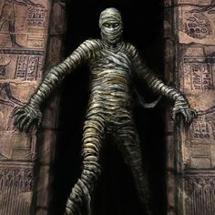 a creepy looking creature standing in the entrance to an ancient building with egyptian writing on it