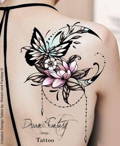 the back of a woman's shoulder with tattoos on it and flowers in the center