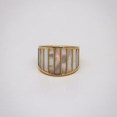 A touch of modern architecture aesthetic for this striped mother of pearl ring. This statement piece is made of gold plated stainless steel, and it is an ideal piece for everyday wear. 18k gold plated Stainless steel base Waterproof and tarnish free Available in US size 6-8 Ring sizing chart Ring Sizing Chart, Uncut Gems, Architecture Aesthetic, Mother Of Pearl Ring, Funky Jewelry, Jewelry Lookbook, Cz Ring, Jewelry Inspo, Dream Jewelry