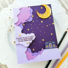 there is a card with a house and stars on it