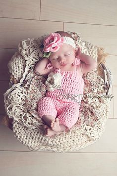 a baby is sleeping in a basket with flowers on it's head and the caption says, spring sale entire store is marked down