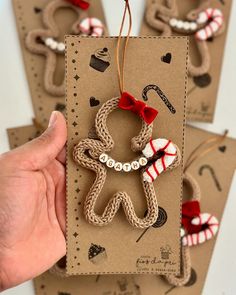 handmade christmas ornament with gingerbread man on brown card and red bow