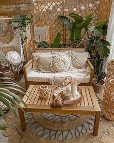 a living room with wicker furniture and plants