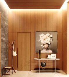 a living room with wood paneling and a painting on the wall