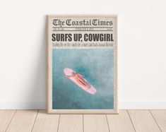 an old newspaper cover with a pink surfboard floating in the water on top of it