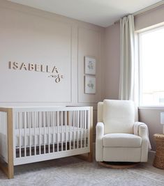 a baby's room with a rocking chair and crib