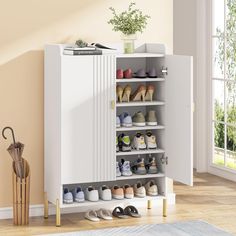 a white cabinet with several pairs of shoes in it