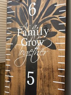 a wooden ruler with the words family and growth on it