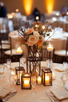 Romantic fall wedding decor inspirations with a centerpiece featuring autumnal flowers, candles, and rustic elements. Ideal for elegant fall weddings. Fall Inspired Centerpieces Wedding, Rustic Glam Wedding Centerpieces, Diy Centerpieces Wedding Fall, Mirrors In Wedding Decor, Enclosed Candles Wedding, Wedding Centerpieces Autumn, Fall Wedding Reception Table Decorations, Winery Wedding Table Decor, Rust Centerpiece Wedding