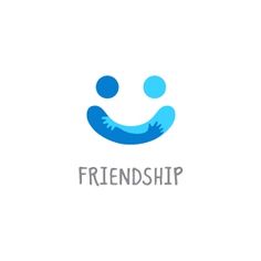 the logo for friendship is blue and has an image of a smiling face on it