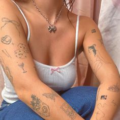 a woman with many tattoos on her arm