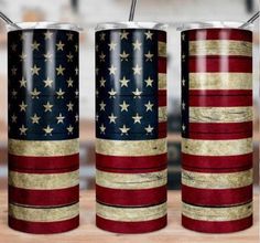 two red, white and blue tumblers sitting on top of a wooden table