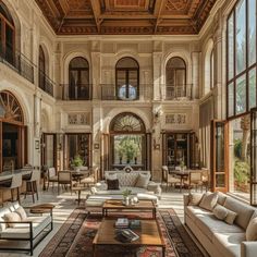 a large living room with high ceilings and lots of windows on the wall, along with couches and chairs