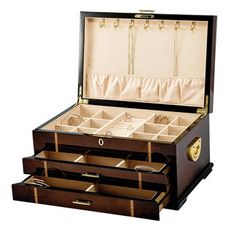 an open wooden jewelry box with three drawers