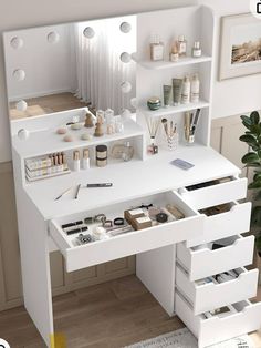 a white desk with lots of drawers and items on it in front of a mirror