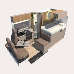 the interior of a small airplane with a bed, couch and kitchenette in it