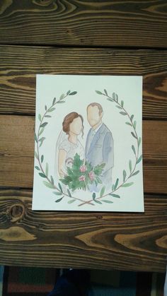 a watercolor painting of a bride and groom in a wreath frame with greenery