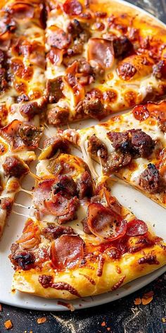 a pizza with pepperoni, sausage and cheese on a white plate sitting on a table