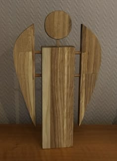 a wooden sculpture sitting on top of a table