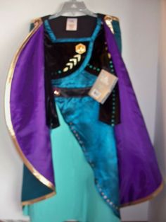 the costume is blue and purple with gold trim