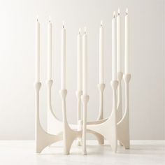 a group of white candles sitting next to each other