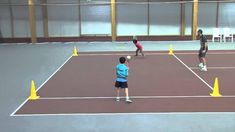 three people are playing tennis on a court