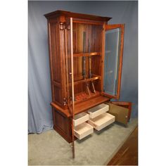 an old wooden cabinet with drawers in it