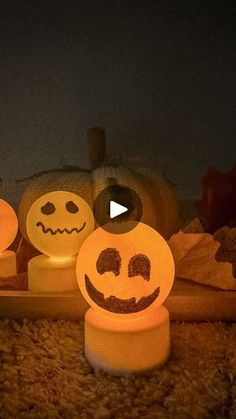 three pumpkins with faces carved into them