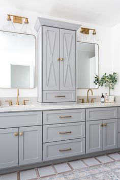 a bathroom vanity with two sinks and large mirrors on the wall above it is instagram