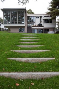 a set of stepping stones in front of a house