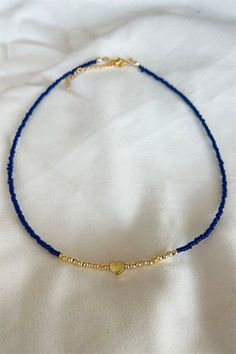 Basic Description: Great simple piece for every occasion. Handmade assorted navy seed beaded necklace. Very lightweight and dainty. Necklaces are joined with a lobster-style clasp and two inch extended chain.  Sizing:  Each necklace is made with a two inch extender chain so the size can be adjusted to your liking. For example, the 16 inch necklace can be extended up to 18 inches. Care: While necklaces will not be damaged by moisture, avoid getting your necklace wet to prevent potential fading or Seed Beaded Necklace, Simple Beaded Necklaces, Dainty Necklaces, 16 Inch Necklace, Blue Beaded Necklace, Seed Bead Necklace, Blue Necklace, Bead Jewellery, Seed Bead Jewelry