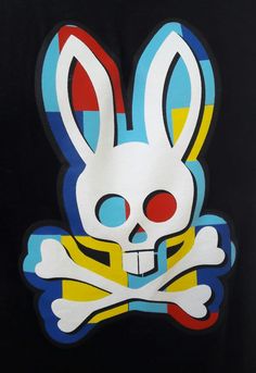 a skull and crossbones with a white rabbit on it's head is painted in bright colors