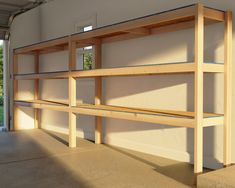 an empty shelf in the middle of a garage