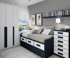 a bedroom with a bed, bookshelf and dressers in white and black