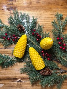 pine cones and berries are sitting on the table