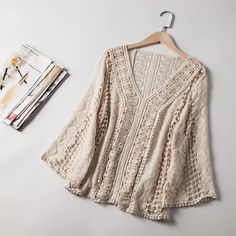 Women's Wholesale New V-neck Lace Hollowed-out Hook Pullover Shirt on Luulla Fall Crochet V-neck Top With Crochet Trim, Lace V-neck Top With Crochet Trim, White Lace V-neck Crochet Top, Cream Long Sleeve Crochet Top, Bohemian Style, White V-neck Lace Top With Crochet Trim, Bohemian V-neck Crochet Lace Top, Cream V-neck Top With Crochet Trim, V-neck Lace Patchwork Top For Fall, Beige Long Sleeve Crochet Top With Open Knit