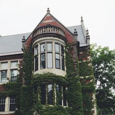 an old brick building covered in ivy