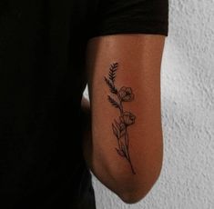 a person with a flower tattoo on their arm