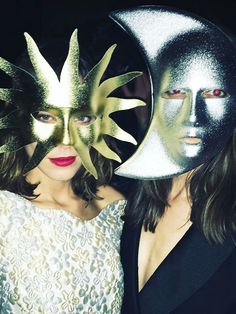 two women with masks on their faces are posing for the camera in front of an instagram