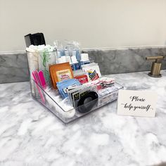 a bathroom counter with personal care items on it