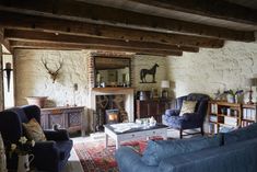 a living room filled with furniture and a fire place